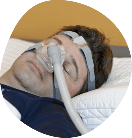 Sleeping man wearing C P A P mask over his face