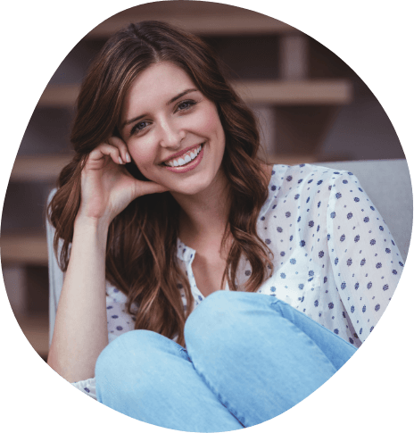 Smiling young woman with white flowery blouse