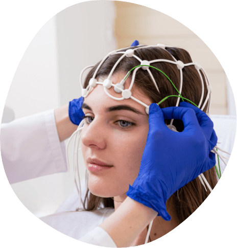 Young woman wearing electrodes on her head for sleep testing