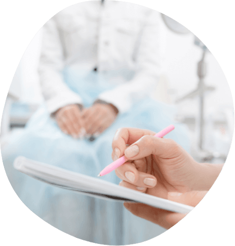 Medical professional using stylus to type on tablet