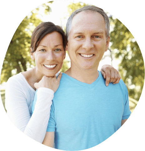 Older man and woman smiling together outdoors