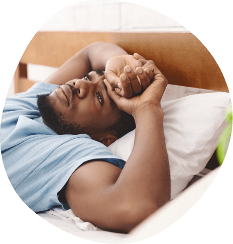 Man lying awake in bed