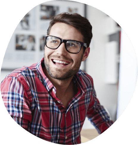 Smiling man with glasses and red plaid shirt
